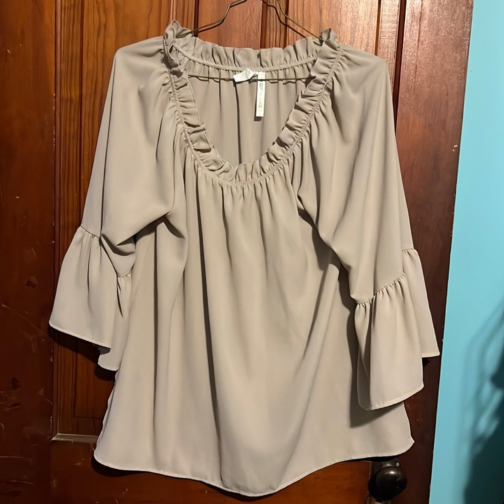 Lightweight tan top that goes about mid arm. Tag says L but i think more like XL